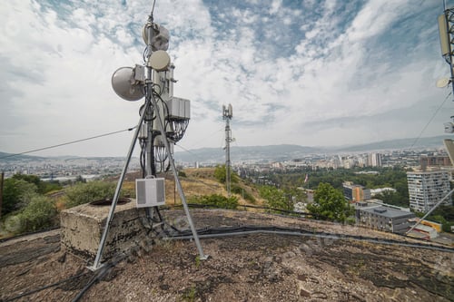 Preview: Cellular tower with cityscape below