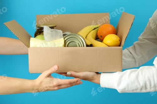 Preview: Donate concept with giving a donate box on blue background