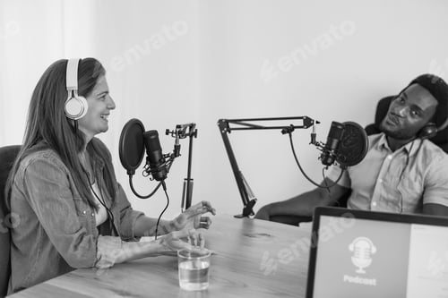 Preview: Multiracial people working together inside studio while streaming live podcast