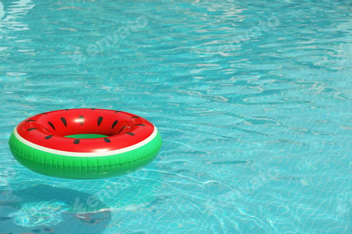 Preview: Inflatable ring floating in pool on sunny day