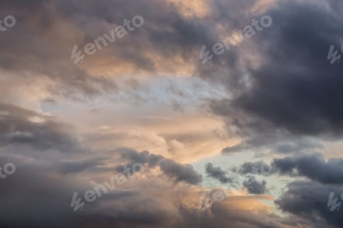 Preview: Dramatic View of a cloudscape during a dark, rainy and colorful sunset