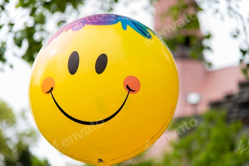 Preview: Selective focus shot of a happy face balloon - happiness concept
