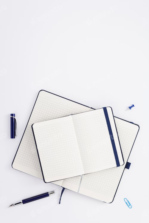 Preview: notebook and stationary at white background