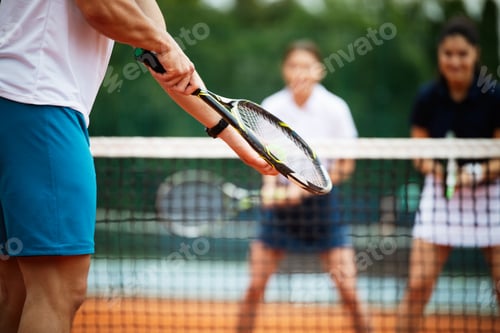Preview: Tennis player prepares to serve ball during tennis match