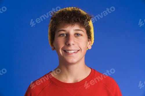 Preview: White boy wearing hat smiling and looking at camera