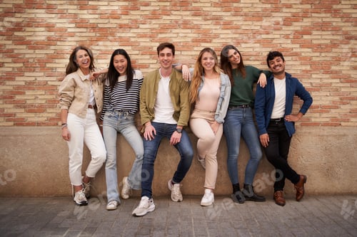 Preview: Multiracial happy friends posing for photo looking at cheerful camera. Group portrait smiling people