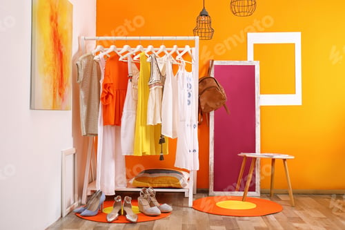 Preview: Stylish dressing room interior with clothes rack and mirror