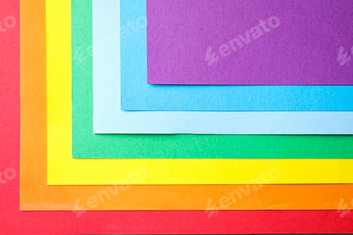 Preview: Sheets of multicolored paper, top view. Rainbow palette