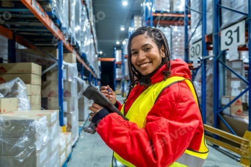 Preview: Woman worker scanning inventory in cold storage warehouse