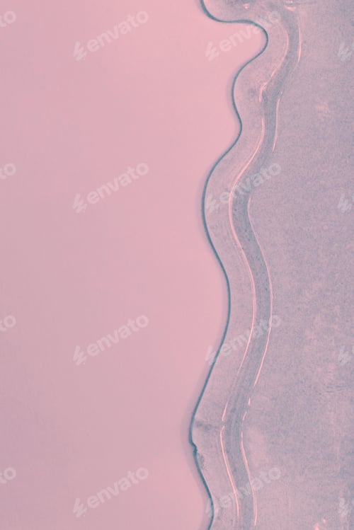 Preview: viscous pure transparent cosmetic gel on pink background. tactile , skincare, cosmetics concept.