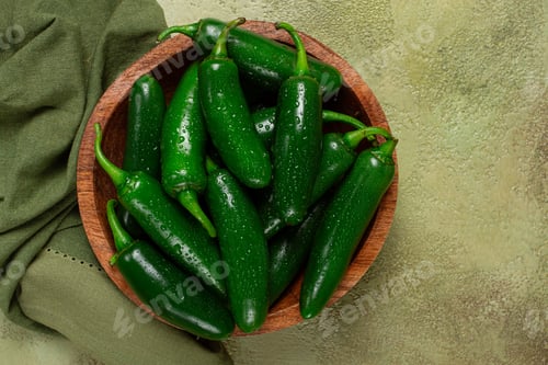 Preview: fresh padron pepper, raw, in a wooden bowl, on the table,