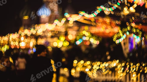 Preview: Blurred photo of Christmas carousel at the fair near GUM shop on Red Square in Moscow