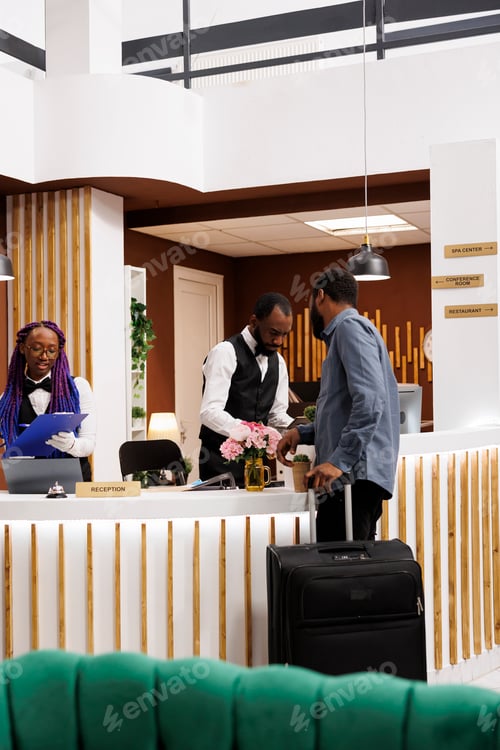 Preview: Hotel front desk staff assisting guests