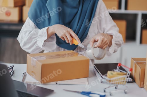 Preview: Small Startup Muslim Woman Checking parcels at work, freelancers, salespeople, checking production o