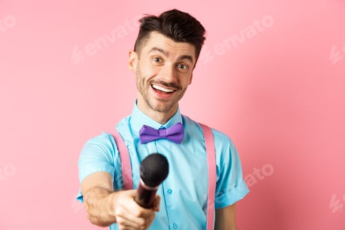 Preview: Smiling guy with moustache and bow-tie asking for comments or interview, stretch out hand with