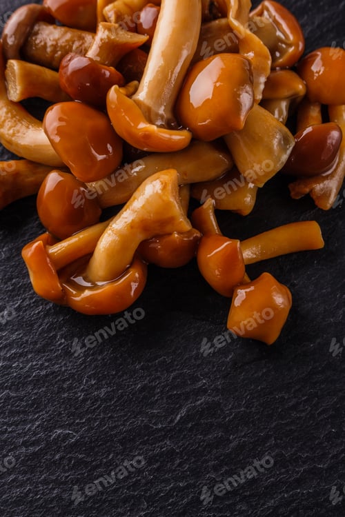 Preview: pickled vegetables on a dark stone background