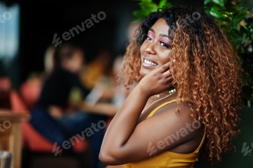 Preview: African american woman in yellow dress