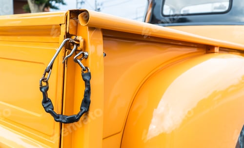 Preview: Yellow Truck Bed with Metal Security Chain