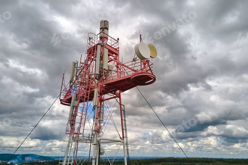 Preview: Aerial view of telecommunications cell phone tower with wireless communication antennas