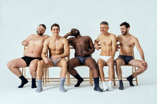 Preview: Group of multiethnic men posing for a male edition body positive beauty set