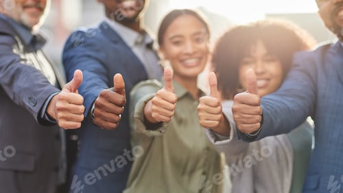 Preview: Were ready to take on the world. Shot of a group of businesspeople giving the thumbs up.