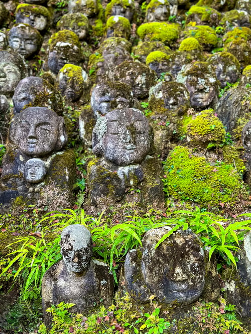 Preview: Moss Covered Buddhist Rakan Stone Sculptures at Otagi Nenbutsu-Ji Buddhist temple in Kyoto, Japan. A