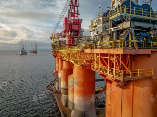 Preview: Sunset View of an Oil and Gas Rig and Platform at Sea
