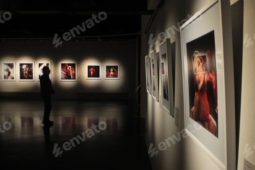 Preview: Visitors to a classical art gallery or museum view the exhibits people or tourists