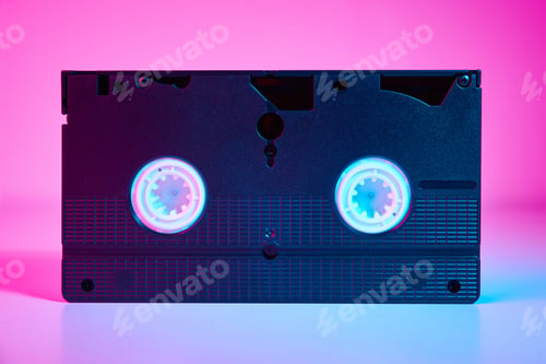 Preview: Video cassete on the color background. Retro vhs cassette tape