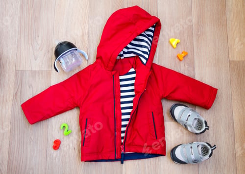Preview: baby winter clothing, concept, autumn, sneakers, caps, toys. how to dress baby in winter.