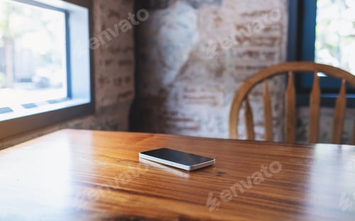 Preview: A single mobile phone on wooden table