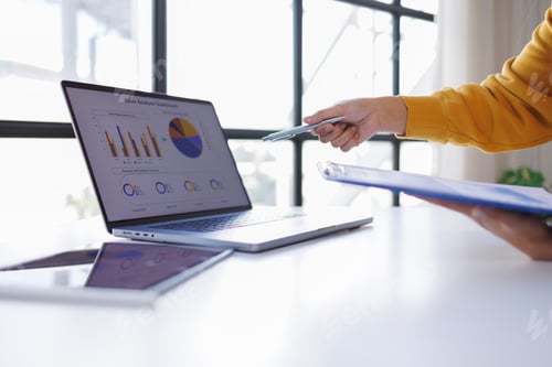 Preview: Business woman Working on Laptop with Data Analytics Dashboard
