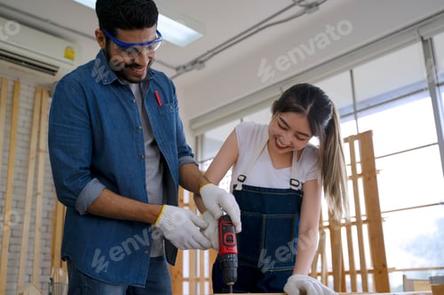 Preview: Carpenters are working at woodshop.