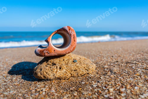 Preview: Bizarre stone with hole on the seashore