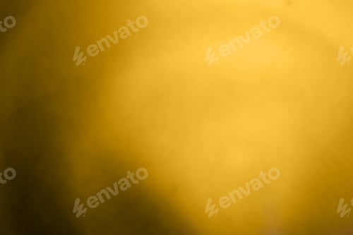 Preview: Blurred view of plain golden surface as background