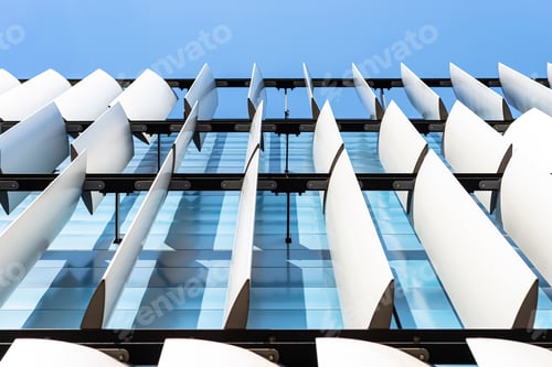 Preview: The facade of a modern building with an innovative facade made of automatic, movable blinds.