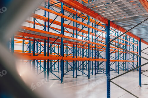 Preview: Empty Warehouse Interior With Large Metal Racks and Concrete Floor
