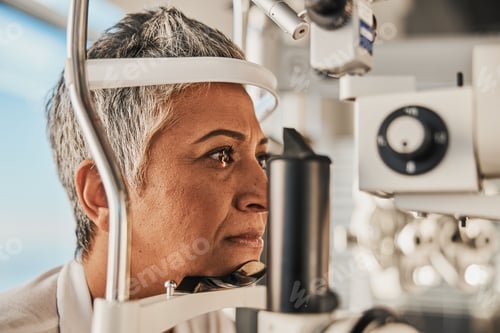 Preview: Optometry, slit lamp and eye exam by senior woman or patient with medical insurance using machine.