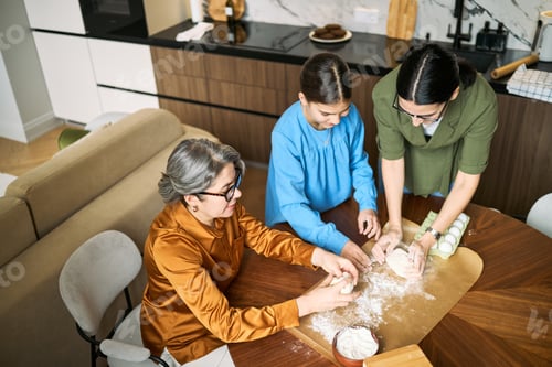 Preview: Senior Woman and Family Baking Together for Home Lifestyle Campaign