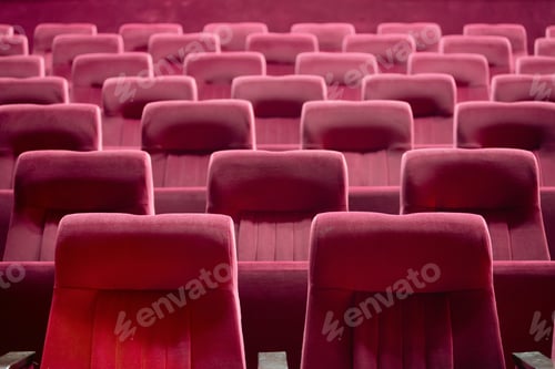 Preview: Empty red chairs for audience in the theater