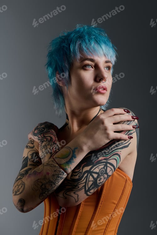 Preview: A vibrant young woman showcases her stylish look with colorful hair and striking tattoos