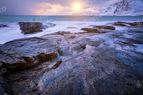 Preview: Coast of Norwegian sea on rocky coast in fjord on sunset