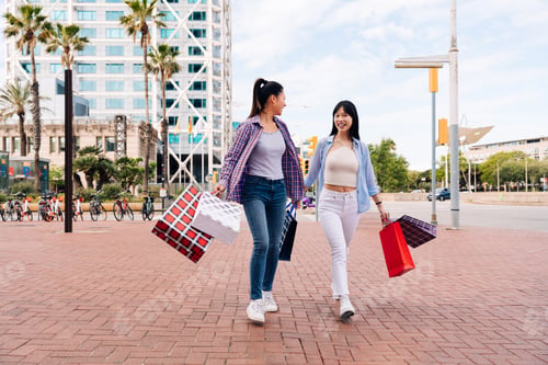 Preview: Happy beautiful chinese women friends bonding in the city