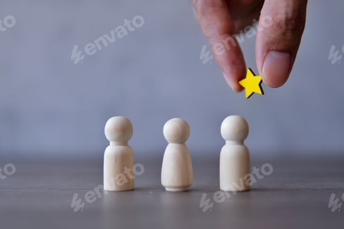 Preview: Hand holding a star over the team.