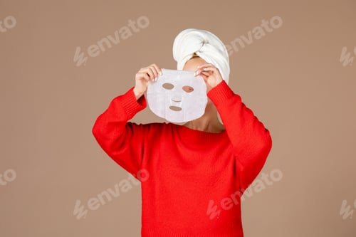 Preview: front view young female with face mask in her hands on pink background woman shower moisturizing spa