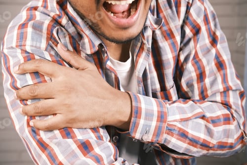 Preview: man suffering pain in hand close up