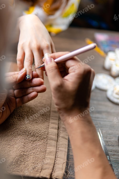 Preview: Nail Artist Applying Design with Fine Brush