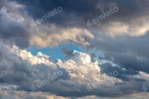 Preview: Cloud on blue sky background. Cloudscape grey and orange shade. Twilight light color the cloudy sky