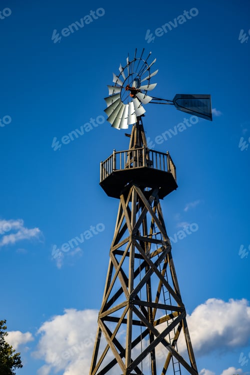 Preview: Closeup of an aeration windmill in the cloudy sky background