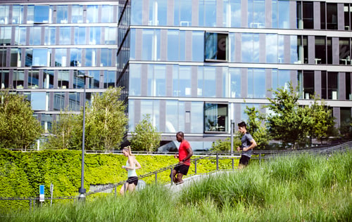 Preview: Young people in the city running together.